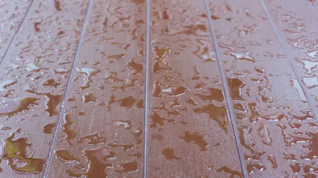 Water droplets on a wood plank floor